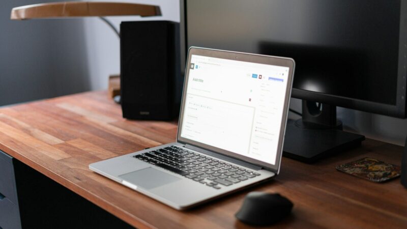 Laptop on a desk with WordPress screen.